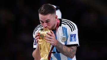 LUSAIL CITY, QATAR - DECEMBER 18: Alexis Mac Allister of Argentina celebrates with the trophy after the FIFA World Cup Qatar 2022 Final match between Argentina and France at Lusail Stadium on December 18, 2022 in Lusail City, Qatar. (Photo by Alex Livesey - Danehouse/Getty Images)