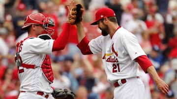 St. Louis Cardinals relief pitcher Andrew Miller, right, and catcher Matt Wieters celebrate an 11-7 victory over the Los Angeles Dodgers after a baseball game Thursday, April 11, 2019, in St. Louis. (AP Photo/Jeff Roberson)