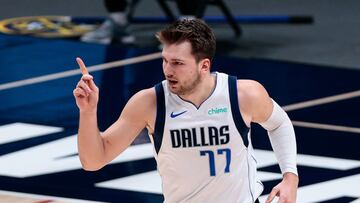 Jan 7, 2021; Denver, Colorado, USA; Dallas Mavericks guard Luka Doncic (77) motions as he dribbles the ball up court in the first quarter against the Denver Nuggets at Ball Arena. Mandatory Credit: Isaiah J. Downing-USA TODAY Sports