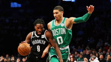 Jan 6, 2018; Brooklyn, NY, USA; Brooklyn Nets forward DeMarre Carroll (9) dribbles the ball against Boston Celtics forward Jayson Tatum (0) during the first half at Barclays Center. Mandatory Credit: Andy Marlin-USA TODAY Sports