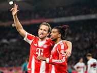Bayern Munich's English forward #09 Harry Kane (L) celebrates with Bayern Munich's French midfielder #17 Michael Olise after scoring his side's 5th goal to complete his hat-trick during the German first division Bundesliga football match between VfB Stuttgart and Bayern Munich in Stuttgart on December 6, 2025. (Photo by THOMAS KIENZLE / AFP) / DFL REGULATIONS PROHIBIT ANY USE OF PHOTOGRAPHS AS IMAGE SEQUENCES AND/OR QUASI-VIDEO
