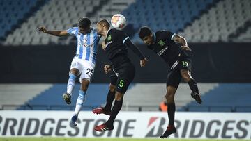 AVELLANEDA, ARGENTINA - MARCH 12: Matias Zaracho of Racing Club fights for the ball with Gaston Gil Romero and Carlos Beltran of Alianza Lima during a Group F match between Racing Club and Alianza Lima as part of Copa CONMEBOL Libertadores 2020 at Juan Do