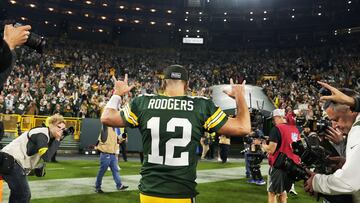 GREEN BAY, WISCONSIN - OCTOBER 02: Aaron Rodgers #12 of the Green Bay Packers celebrates after his team's 27-24 win in overtime against the New England Patriots at Lambeau Field on October 02, 2022 in Green Bay, Wisconsin.   Patrick McDermott/Getty Images/AFP