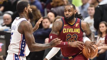 Dec 9, 2017; Cleveland, OH, USA; Philadelphia 76ers forward Robert Covington gets a hand on the ball as Cleveland Cavaliers forward LeBron James (23) drives to the basket against Philadelphia 76ers forward Amir Johnson (5) during the first quarter at Quicken Loans Arena. Mandatory Credit: Ken Blaze-USA TODAY Sports