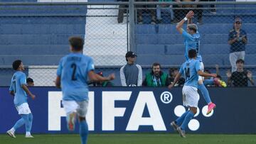 Israel's forward Dor Turgeman (R, top) celebrates after scoring his team's third goal during extra-time of the Argentina 2023 U-20 World Cup quarter-final football match between Israel and Brazil at the San Juan del Bicentenario stadium in San Juan, Argentina, on June 3, 2023. (Photo by Andres Larrovere / AFP)