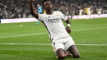 Real Madrid's Brazilian forward #07 Vinicius Junior celebrates scoring his team's second goal during the UEFA Champions League final football match between Borussia Dortmund and Real Madrid, at Wembley stadium, in London, on June 1, 2024. (Photo by INA FASSBENDER / AFP)