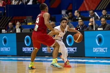 Mexico's Paul Stoll (L) pressures Puerto Rico's Jordan Howard during the 2024 FIBA Men's Olympic Qualifying Tournament basketball match between Puerto Rico and Mexico in San Juan, Puerto Rico, on July 6, 2024. (Photo by Ricardo ARDUENGO / AFP)