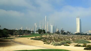 DUBAI, UNITED ARAB EMIRATES - DECEMBER 06: A general view of the par 4, eighth hole as the early morning fog lingers against the Dubai Marina skyline during the pro-am as a preview for the 2016 Omega Dubai Ladies Masters on the Majlis Course at the Emirates Golf Club on December 6, 2016 in Dubai, United Arab Emirates. (Photo by David Cannon/Getty Images)