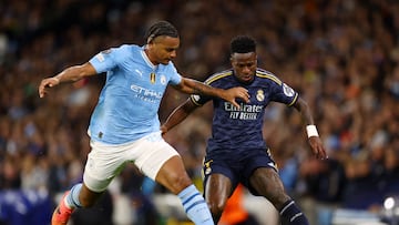 Soccer Football - Champions League - Quarter Final - Second Leg - Manchester City v Real Madrid - Etihad Stadium, Manchester, Britain - April 17, 2024 Real Madrid's Vinicius Junior in action with Manchester City's Manuel Akanji REUTERS/Carl Recine