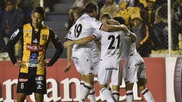 Argentina Lanus&#039; NicolxE1s Pasquini (C) celebrates after scoring against Bolivia&#039;s The Strongest, during their Copa Libertadores match at Hernando Siles Stadium in La Paz, on July 06, 2017 / AFP PHOTO / ar / AIZAR RALDES