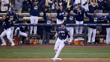 MILWAUKEE, WI - OCTOBER 12: Brandon Woodruff #53 of the Milwaukee Brewers celebrates after hitting a solo home run against Clayton Kershaw #22 of the Los Angeles Dodgers during the third inning in Game One of the National League Championship Series at Mil