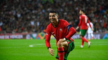 Portugal's forward Cristiano Ronaldo (L) reacts during the UEFA Nations League, League A, Group 1 football match between Portugal and Poland at the Dragao stadium in Porto, on November 15, 2024. (Photo by Miguel RIOPA / AFP)