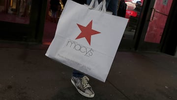 FILE PHOTO: A customer exits the Macy's flagship department store in midtown Manhattan in New York City, November 11, 2015.  REUTERS/Brendan McDermid/File Photo