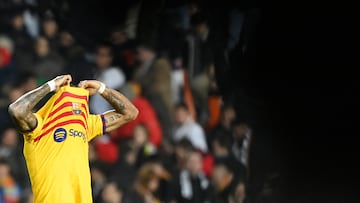 Barcelona's Brazilian forward #11 Raphinha reacts at the end of the Spanish league football match between Valencia CF and FC Barcelona at the Mestalla stadium in Valencia on December 16, 2023. (Photo by JOSE JORDAN / AFP)