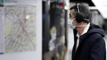 PARIS, FRANCE - MARCH 16: A passenger wearing a protective mask looks at a subway map at the Chatelet subway station on March 16, 2020 in Paris, France. French Prime Minister Edouard Philippe announced last Saturday that France must shut shops, restaurants and entertainment facilities to slow down the spread of the coronavirus. Due to a sharp increase in the number of cases of the COVID-19 virus declared in Paris and throughout France, several sporting, cultural and festive events have been postponed or cancelled. The epidemic has exceeded 6,500 dead for more than 169,000 infections across the world. French President, Emmanuel Macron will speak this evening during a televised speech devoted to the coronavirus crisis. (Photo by Chesnot/Getty Images)