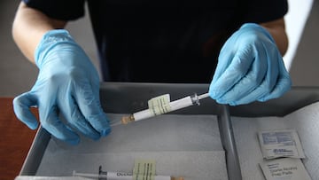 ANKARA, TURKEY - OCTOBER 27: A health care worker holds an injection syringe of the phase 3 vaccine trial, developed against the novel coronavirus (COVID-19) pandemic by the U.S. Pfizer and German BioNTech company, at the Ankara University Ibni Sina Hospital in Ankara, Turkey on October 27, 2020. This vaccine candidate, within the scope of phase 3 studies, was injected to volunteers in Ankara University Ibni Sina Hospital. (Photo by Dogukan Keskinkilic/Anadolu Agency via Getty Images)