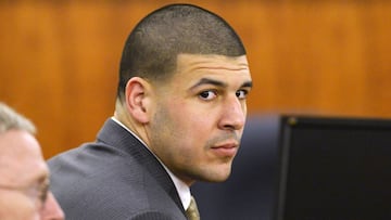 FILE PHOTO:  Former NFL player Aaron Hernandez and defense attorney Charles Rankin wait in the courtroom during the jury deliberation in his murder trial at the Bristol County Superior Court in Fall River, Massachusetts, U.S. on April 10, 2015.  REUTERS/CJ Gunther/Pool/File Photo