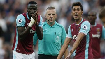 Britain Football Soccer - West Ham United v Southampton - Premier League - London Stadium - 25/9/16
 West Ham United&#039;s Cheikhou Kouyate and Alvaro Arbeloa remonstrate with referee Jonathan Moss
 Action Images via Reuters / Matthew Childs
 Livepic
 EDITORIAL USE ONLY. No use with unauthorized audio, video, data, fixture lists, club/league logos or &quot;live&quot; services. Online in-match use limited to 45 images, no video emulation. No use in betting, games or single club/league/player publications. Please contact your account representative for further details.