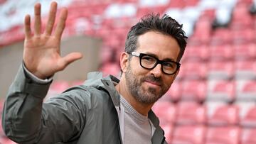 US actor and Wrexham owner Ryan Reynolds waves to fans ahead of the English FA Cup fourth round football match between Wrexham and Sheffield United at the Racecourse Ground Stadium in Wrexham, north Wales, on January 29, 2023. (Photo by Oli SCARFF / AFP) / RESTRICTED TO EDITORIAL USE. No use with unauthorized audio, video, data, fixture lists, club/league logos or 'live' services. Online in-match use limited to 120 images. An additional 40 images may be used in extra time. No video emulation. Social media in-match use limited to 120 images. An additional 40 images may be used in extra time. No use in betting publications, games or single club/league/player publications. / 