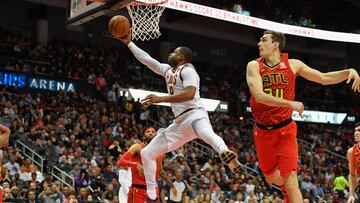 Nov 30, 2017; Atlanta, GA, USA; Cleveland Cavaliers guard Dwyane Wade (9) scores past Atlanta Hawks forward Tyler Cavanaugh (34) during the first half at Philips Arena. Mandatory Credit: Dale Zanine-USA TODAY Sports
