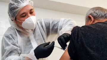 A man receives a dose of a coronavirus vaccine produced by the Chinese pharmaceutical company Anhui Zhifei Longcom Biopharmaceutical Co., registered locally under the name ZF-UZ-VAC 2001, at a clinic in Tashkent on April 1, 2021, on the first day of Uzbek