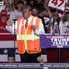 Trump steals the show dancing YMCA in a garbage worker costume at rally