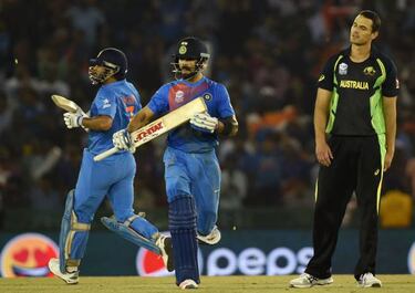 Kohli dazzles to propel India into World T20 semis