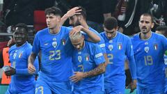 Italy's defender Federico Dimarco (3L) celebrates with teammates scoring his team's second goal during the UEFA Nations League Group 3 football match between Hungary and Italy in Budapest on September 26, 2022. (Photo by Attila KISBENEDEK / AFP)