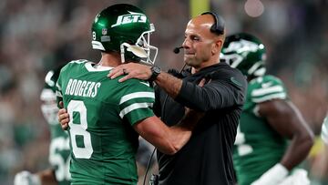 Sep 19, 2024; East Rutherford, New Jersey, USA; New York Jets head coach Robert Saleh hugs quarterback Aaron Rodgers (8) after a touchdown by running back Breece Hall (not pictured) during the second quarter against the New England Patriots at MetLife Stadium. Mandatory Credit: Brad Penner-Imagn Images
