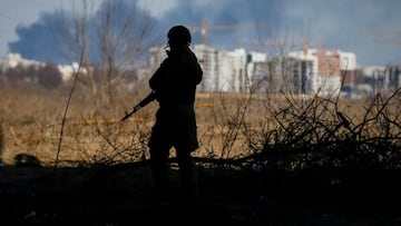 A member of the Ukrainian forces takes a position, amid Russia's invasion of Ukraine, in Irpin, Ukraine March 12, 2022. Picture taken March 12, 2022. REUTERS/Gleb Garanich