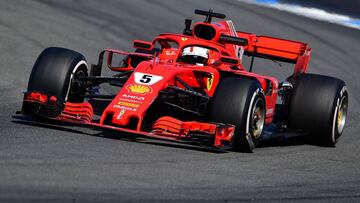 Ferrari's German driver Sebastian Vettel steers his car during the second free practice session ahead of the German Formula One Grand Prix at the Hockenheimring racing circuit on July 20, 2018 in Hockenheim, southern Germany. / AFP PHOTO / ANDREJ ISAKOVIC