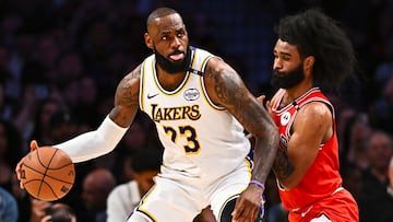 Mar 22, 2025; Los Angeles, California, USA; Los Angeles Lakers forward LeBron James (23) looks to pass against Chicago Bulls guard Coby White (0) during the second half at Crypto.com Arena. Mandatory Credit: Jonathan Hui-Imagn Images