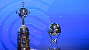 The Copa Libertadores (L) and Copa Sudamericana trophies are displayed before the draw for the round of 16 at the Conmebol headquarters in Luque, Paraguay, on June 2, 2025. (Photo by DANIEL DUARTE / AFP)