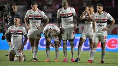 Sao Paulo players react after losing against Liga de Quito in the penalty shoot-out of the Copa Sudamericana quarterfinals second leg football match between Brazil's Sao Paulo and Ecuador's Liga de Quito at the Morumbi stadiumn, in Sao Paulo, Brazil, on August 31, 2023. (Photo by NELSON ALMEIDA / AFP)