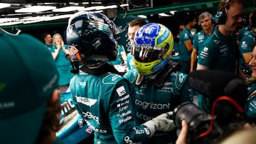 Lance Stroll, Aston Martin F1 Team, and Fernando Alonso, Aston Martin F1 Team, in the garage after Qualifying.