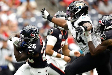 J.J. Taylor of the Houston Texans carries the ball against the Jacksonville Jaguars.