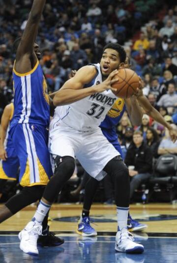 Karl-Anthony Towns y Draymond Green.