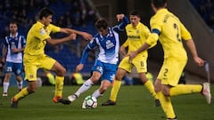 Villarreal&#039;s Spanish midfielder Rodrigo Hernandez (L) vies with Espanyol&#039;s Spanish midfielder Granero (2L) during the Spanish league football match RCD Espanyol vs Villarreal CF on February 18, 2018 at the Cornella-El Prat stadium in Cornella. /