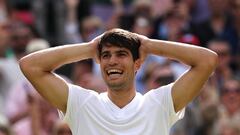 LONDON, ENGLAND - JULY 14: Carlos Alcaraz of Spain celebrates winning Championship point against Novak Djokovic of Serbia in the Gentlemen's Singles Final during day fourteen of The Championships Wimbledon 2024 at All England Lawn Tennis and Croquet Club on July 14, 2024 in London, England. (Photo by Clive Brunskill/Getty Images)