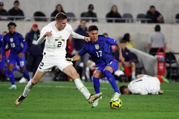 Jan 25, 2023; Los Angeles, California, USA;  USA forward Alejandro Zendejas (17) and Serbia midfielder Marko Ivezic (2) fight for the ball during the second half at BMO Stadium. Mandatory Credit: Kiyoshi Mio-USA TODAY Sports