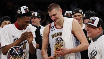 LOS ANGELES, CALIFORNIA - MAY 22: Nikola Jokic #15 of the Denver Nuggets celebrates with teammates after receiving the Most Valuable Player Trophy following game four of the Western Conference Finals against the Los Angeles Lakers at Crypto.com Arena on May 22, 2023 in Los Angeles, California. NOTE TO USER: User expressly acknowledges and agrees that, by downloading and or using this photograph, User is consenting to the terms and conditions of the Getty Images License Agreement.   Harry How/Getty Images/AFP (Photo by Harry How / GETTY IMAGES NORTH AMERICA / Getty Images via AFP)