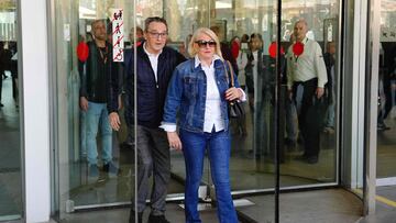 Former refereeing chief Jose Maria Enriquez Negreira leaves a court with his partner after testifying in the ongoing FC Barcelona corruption case, in Barcelona on March 19, 2024. Former refereeing chief Jose Maria Enriquez Negreira chose not to declare during a court appearance today regarding the alleged Barcelona bribery scandal. Court sources told AFP the 78-year-old exercised his right not to declare during a brief appearance in the Barcelona investigation court, after being summoned by investigating judge Joaquin Aguirre. Negreira's court appearance was originally scheduled for February but twice delayed at the petition of his defence, saying he was unfit to testify because of a dementia claim. (Photo by Pau Barrena / AFP)