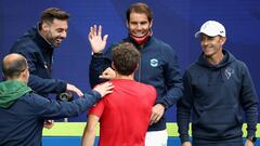 Spain's Rafael Nadal (C-facing) smiles as he celebrates with teammates after Pablo Carreno Busta of Spain (C-back to camera) beat Australia's John Millman in the group B men's singles tennis match on day one of the 2021 ATP Cup in Melbourne on February 2,
