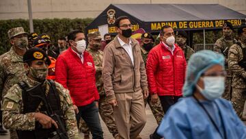 Peru&#039;s President Martin Vizcarra (C) arrives to oversee the distribution of essential products among those in need amid the COVID-19 novel coronavirus pandemic, in Villa Maria del Triunfo, on the southern outskirts of Lima, on September 15, 2020. - Vizcarra pushed back against his opponents on Monday days ahead of an impeachment vote, accusing Congress chief Manuel Merino of &quot;conspiracy&quot; by trying to secure military assurances for a bid to succeed him.
 Congress voted late Friday to open impeachment proceedings against Vizcarra for &quot;moral incapacity&quot; over accusations he incited aides to lie to anti-graft investigators. (Photo by Ernesto BENAVIDES / AFP)