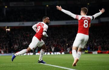 Alexandre Lacazette wheels away after levelling for Arsenal against Liverpool