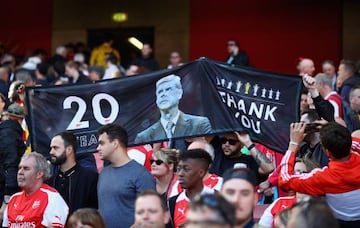 Fans display banners during the Premier League match between Arsenal and Everton at Emirates Stadium