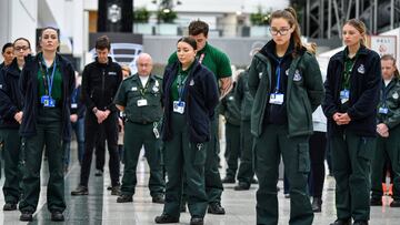 GLASGOW, SCOTLAND - APRIL 28: Medical staff at the Louisa Jordan hospital stand during a UK wide minutes silence to commemorate the key workers who have died with coronavirus on April 28, 2020 in Glasgow, United Kingdom. The moment of silence, commemorating the key workers who have died during the Covid-19 pandemic, was timed to coincide with International Workers' Memorial Day. At least 90 NHS workers are reported to have died in the last month, in addition to transport employees and other key workers. (Photo by Jeff J Mitchell/Getty Images)