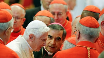 FILE PHOTO: Pope Emeritus Benedict XVI is greeted by Cardinals as he arrives to attend a consistory ceremony in Saint Peter's Basilica at the Vatican February 22, 2014. REUTERS/Max Rossi/File Photo