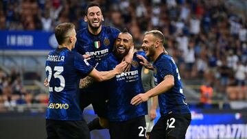 Inter Milan's Chilean midfielder Arturo Vidal (2ndR) celebrates with teammates after he scored the third goal during the Italian Serie A football match Inter Milan vs Genoa at San Siro stadium in Milan, on August 21, 2021. (Photo by MIGUEL MEDINA / A