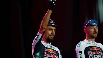 Red Bull-Bora-Hansgrohe's Colombian rider Daniel Felipe Martinez waves on stage during the opening ceremony and team presentation in Tirana, on May 7, 2025, two days before the departure of the Giro d'Italia 2025 cycling race. The Giro d'Italia 2025 cycling race will depart from Durres, Albania on May 9, and finish in Rome on June 1. (Photo by Luca Bettini / AFP)